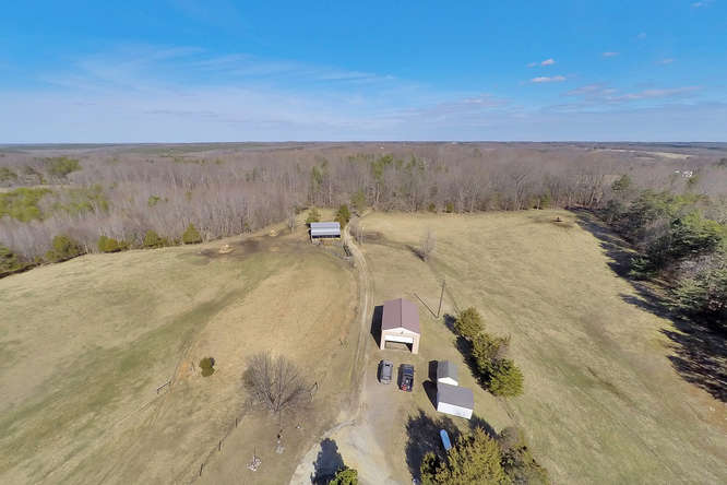 Home, horse barn, equipment barn, storage sheds & fenced pasture